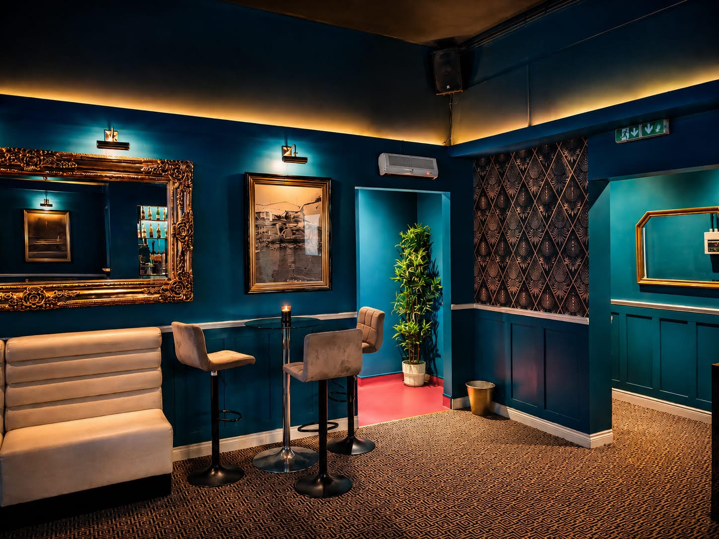 Bar seating at PDI Birmingham with gold-framed mirrors and cream sofas